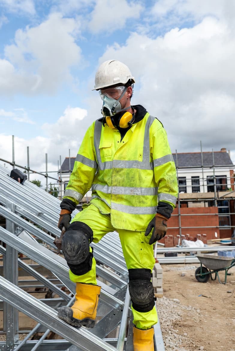 Roofer working on construction site