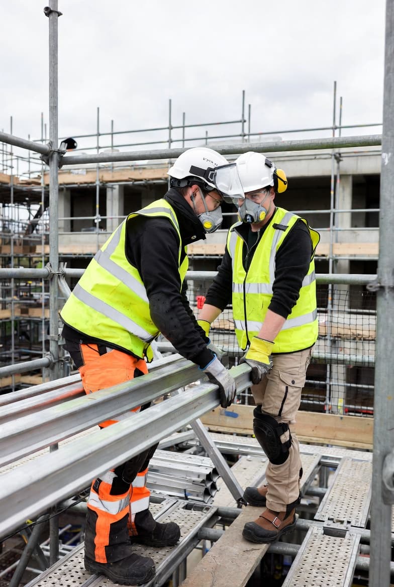 Scaffolder working on construction site